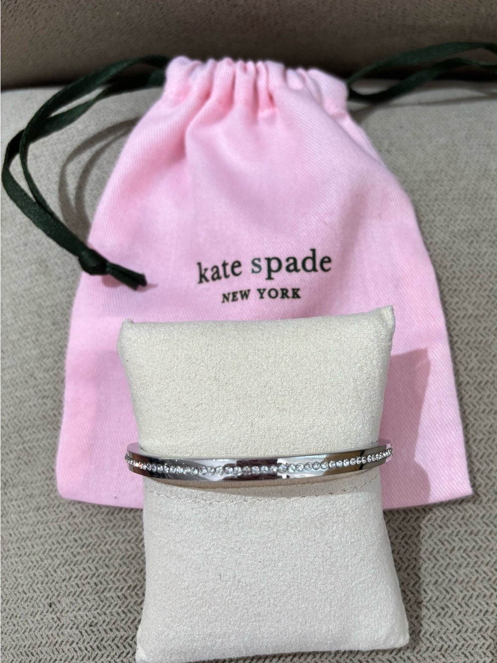 Kate Spade “Ring it Up Pave Bangle”, silvertone and crystals.  Like NEW